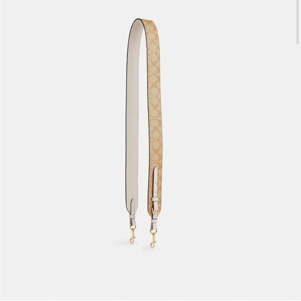 Coach adjustable strap in signature canvas in the color gold/light khaki